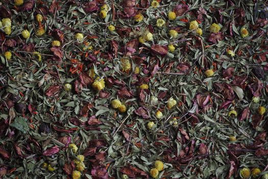 A beautiful background of dried herbs and flowers. Dark tones.