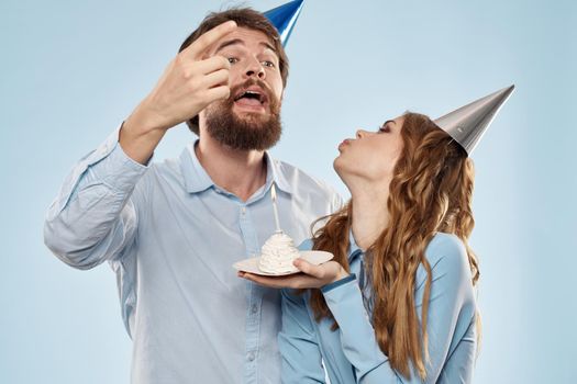 Birthday cake with candle man and woman corporate party fun holidays. High quality photo