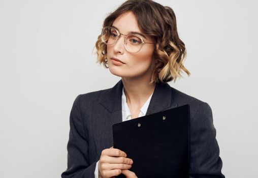 Woman in classic suit secretary business finance documents. High quality photo