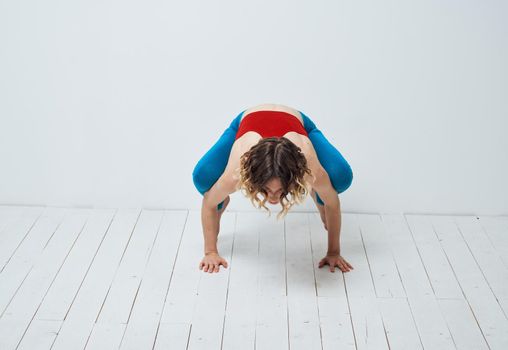 Sportive woman doing exercises on the floor yoga asana meditation. High quality photo