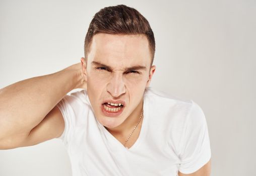 Nervous man touches his head stress Model of emotion. High quality photo