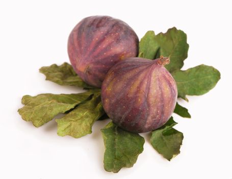 Fruits figs with fig leaves on white background