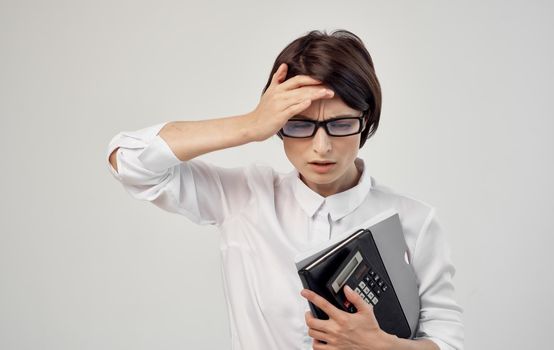 woman with documents in hand and wearing glasses cropped view. High quality photo