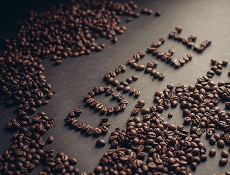 The word written from coffee beans drink aroma arabica cappuccino. High quality photo