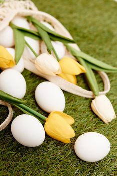 tulip bouquet easter eggs holiday lawn background decoration. High quality photo