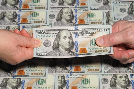 Money background, American dollar from hand to hand. High quality photo