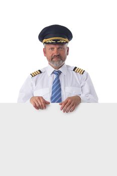 Full length portrait of happy smiling pilot holds blank banner isolated on white background
