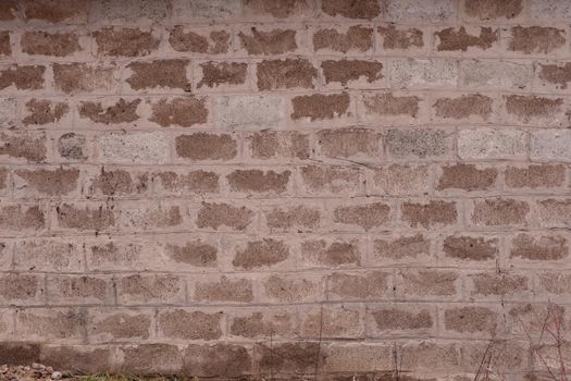 Brick wall made of cinder block. roughly made. Texture.