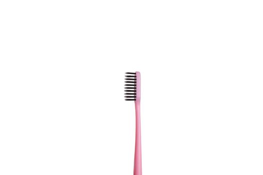 The pink tooth brushing cheek is isolated on a white background. Care and hygiene for the oral cavity