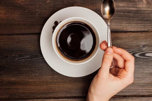 cup of coffee on a wooden table sweets breakfast top view. High quality photo