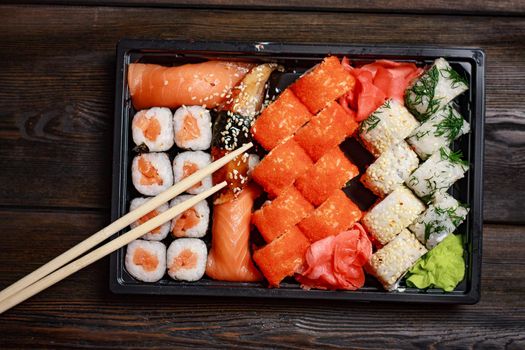 asian cuisine sushi rolls tradition ginger wooden table. High quality photo