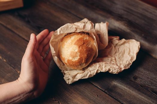 loaf of bread flour product wooden board tray and paper packaging. High quality photo
