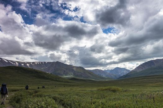 Green mountain valley and sky, travel..On the Oroy pass. Mountain Altai. Siberia. Russia.