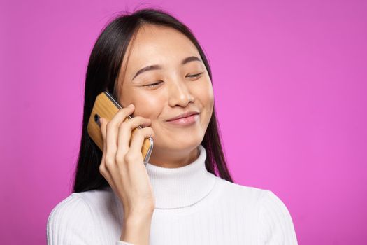 cute asian woman talking on the phone internet communication technology. High quality photo