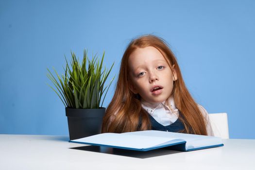schoolgirl holding her head home lessons learning emotions. High quality photo
