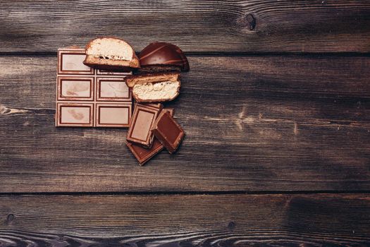 wooden table chocolate bar marshmallow delight cocoa sweets energy. High quality photo