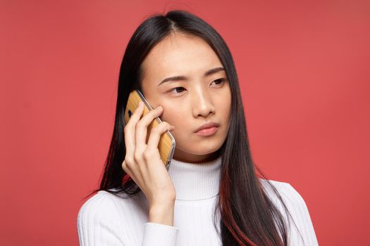 woman asian appearance communicating on the phone well lifestyle technology isolated background. High quality photo