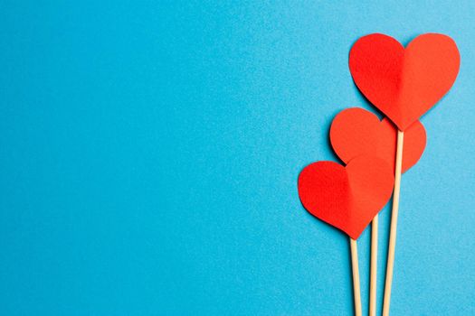 soft heart on stick gift decoration valentines day holiday blue background. High quality photo