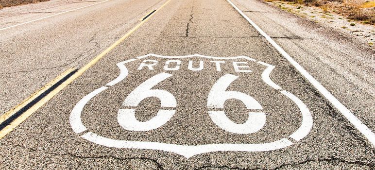 Route 66 road sign. Historic street with nobody. Classic concept for travel and adventure in a vintage way.