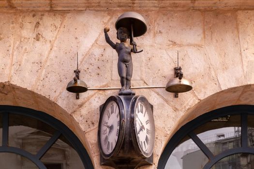 Detail of a mechanical clock on a stone facade (El Morito)