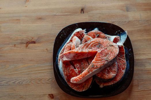 Red pickled fish on a plate food seafood delicacy. High quality photo