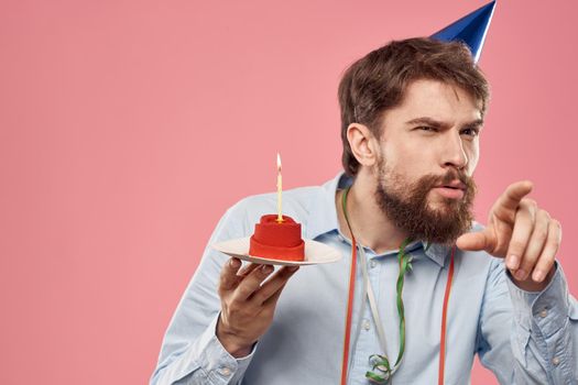 Man birthday party cake with candle cap fun. High quality photo