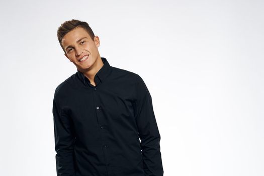 business man in black shirt studio cropped view gray background. High quality photo