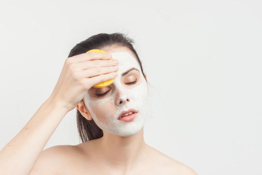 Pretty Brunette Nude Shoulders Facial Cream Spa Treatments. High quality photo