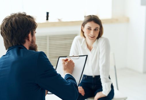 A man next to a woman communication discussion professional consultation mental problems. High quality photo