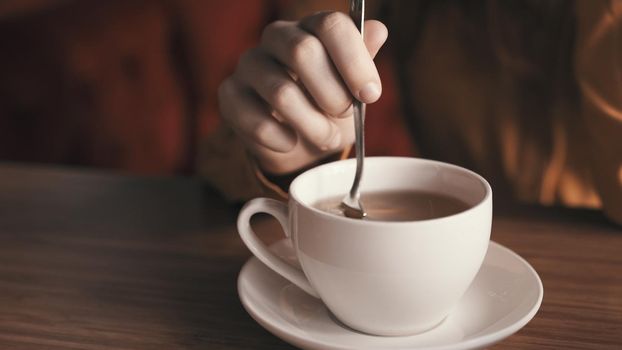 Hot drink in white cup on tea party table rest. High quality photo