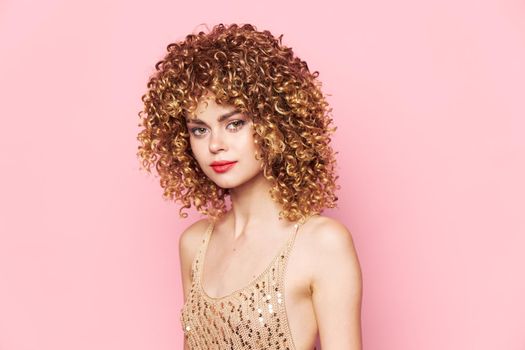 Woman portrait Curly hair red lips charming luxury look pink isolated background