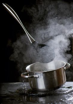 Bubbling water in a pan. Abstract background