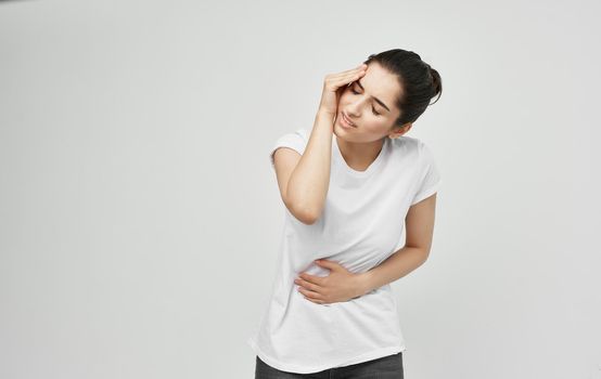 woman in white t-shirt health problems body pain discomfort. High quality photo