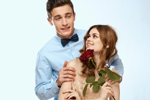 Cute young couple hug rose date luxury charm. High quality photo