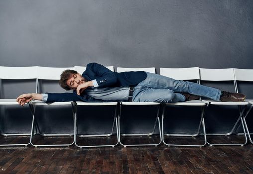 Man in suit on chairs work office career lifestyle. High quality photo