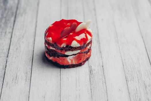 sweet round cake red velvet dessert snack wooden background. High quality photo