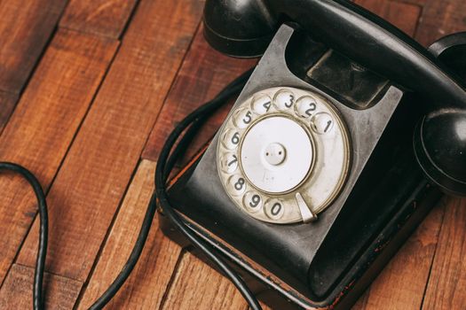 retro telephone nostalgia old technology communication wooden background. High quality photo