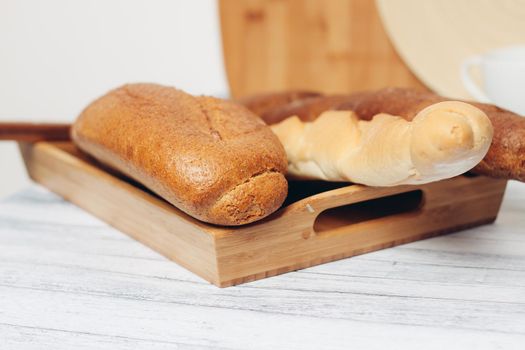 fresh baked loafs in the kitchen bread bin meal. High quality photo