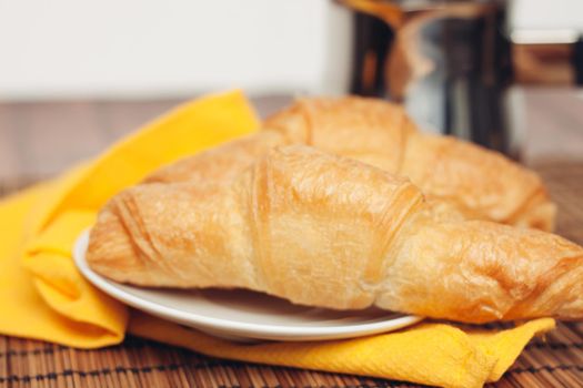 fresh croissants on the table coffee cup breakfast . High quality photo
