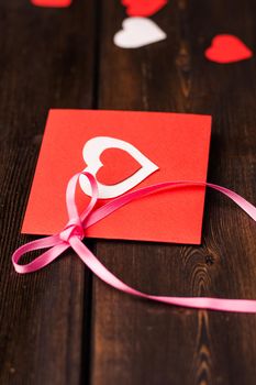 Red card with heart gift holiday love romance. High quality photo