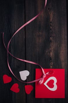 greeting card with heart holiday gift valentines day decoration wooden background. High quality photo