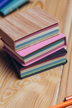 colorful notepads office wooden table paper work is education. High quality photo