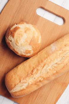 rye loaf on a wooden board top view soft bun. High quality photo