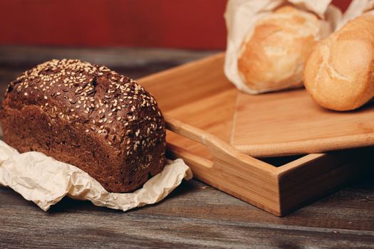 tray with pastry pastries on wooden table . High quality photo