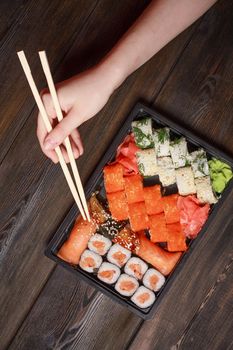 set sushi rolls delicacy wooden sticks top view japanese cuisine. High quality photo
