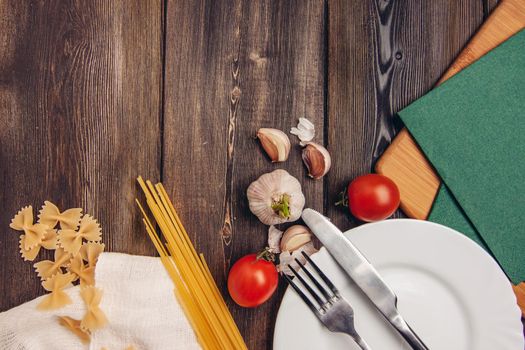 italian cuisine pasta ingredients cherry tomatoes garlic lunch. High quality photo
