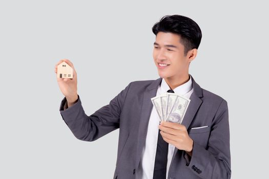 Young asian business man holding home and money dollar for saving for future, insurance agent and credit, debt and loan of finance, purchase home and refinance, investment about real property.
