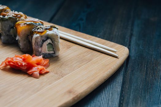 ginger sushi chopsticks wood board japanese cuisine restaurant snack. High quality photo