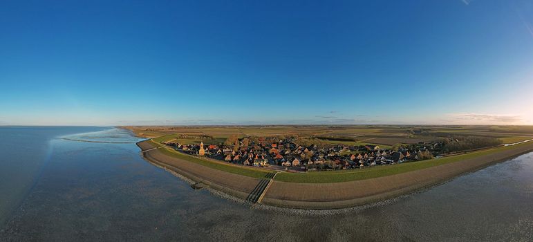 Panoramic aerial from the little village Wierum at the Wadden Sea in the Netherlands