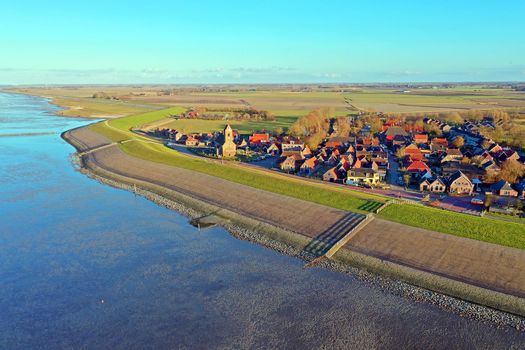 Aerial from the little village Wierum at sunset in Friesland the Netherlands